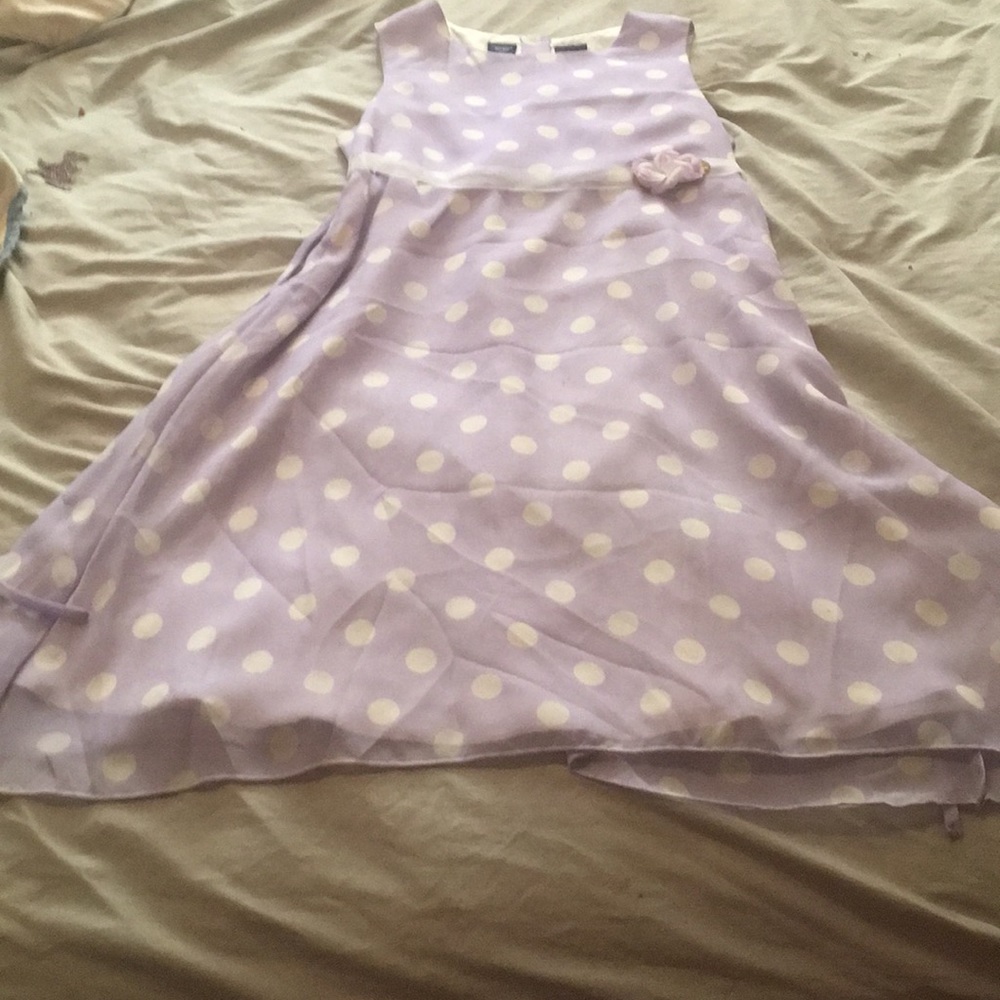 A purple and white poka dot dress